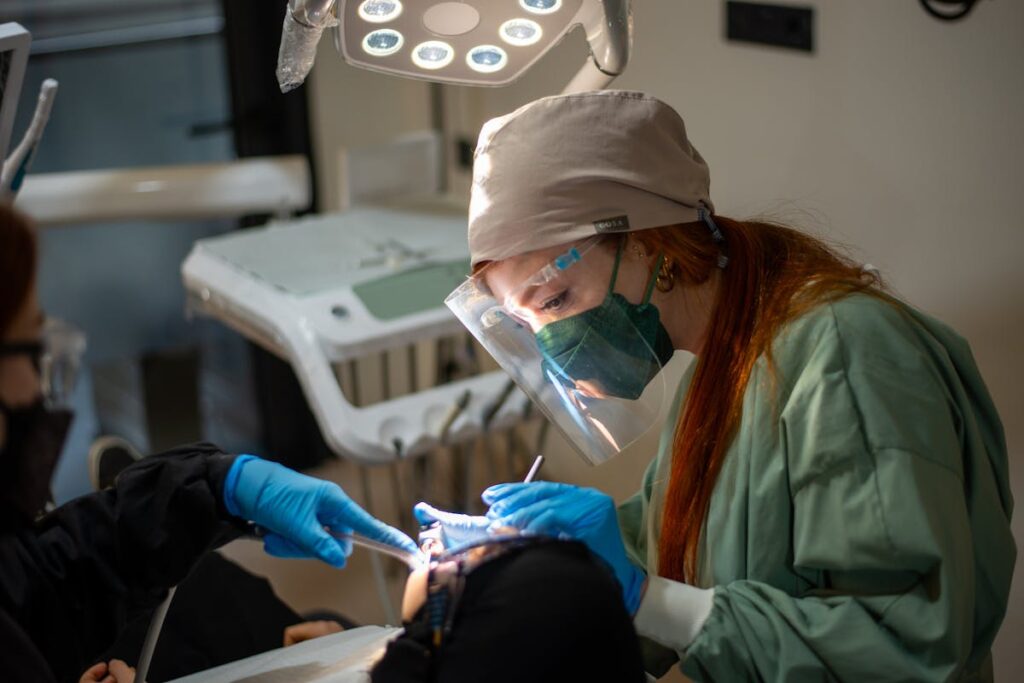 A Dentist Performing a Medical Procedure on a Patient