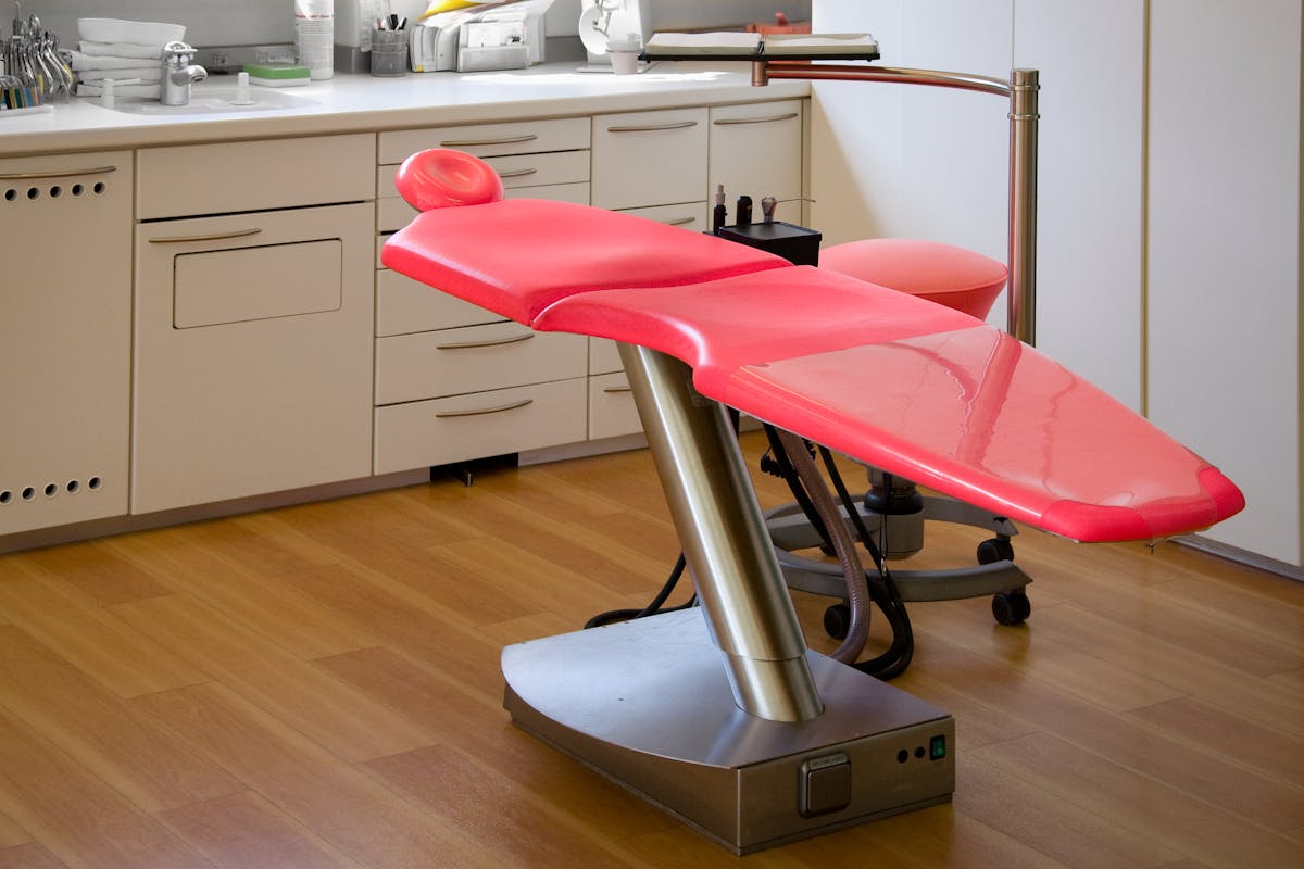Gray Metal Framed Red Dental Treatment Chair Gray Metal Framed Red Dental Treatment Chair