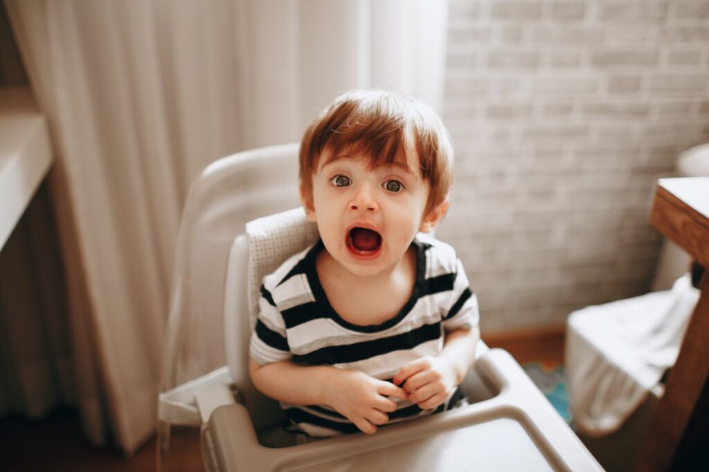 Selective Focus Photo of a Cute Kid Looking at the Camera